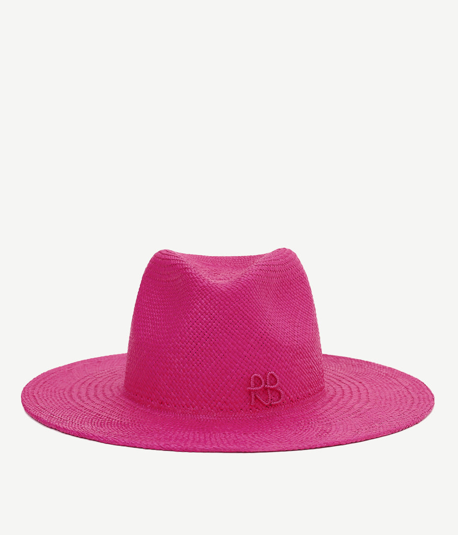 ALLwithoudDIS, Ruslan Baginskiy hones the traditional fedora silhouette with an inciting magenta colour. 100% straw is shaped into a hat on a wooden hat block, developed by Ukrainian artisans. RB monogram puts the finishing touch to this piece of craftsmanship. Meet the implacably vivacious accessory; an unignorable signal for self-expression.
