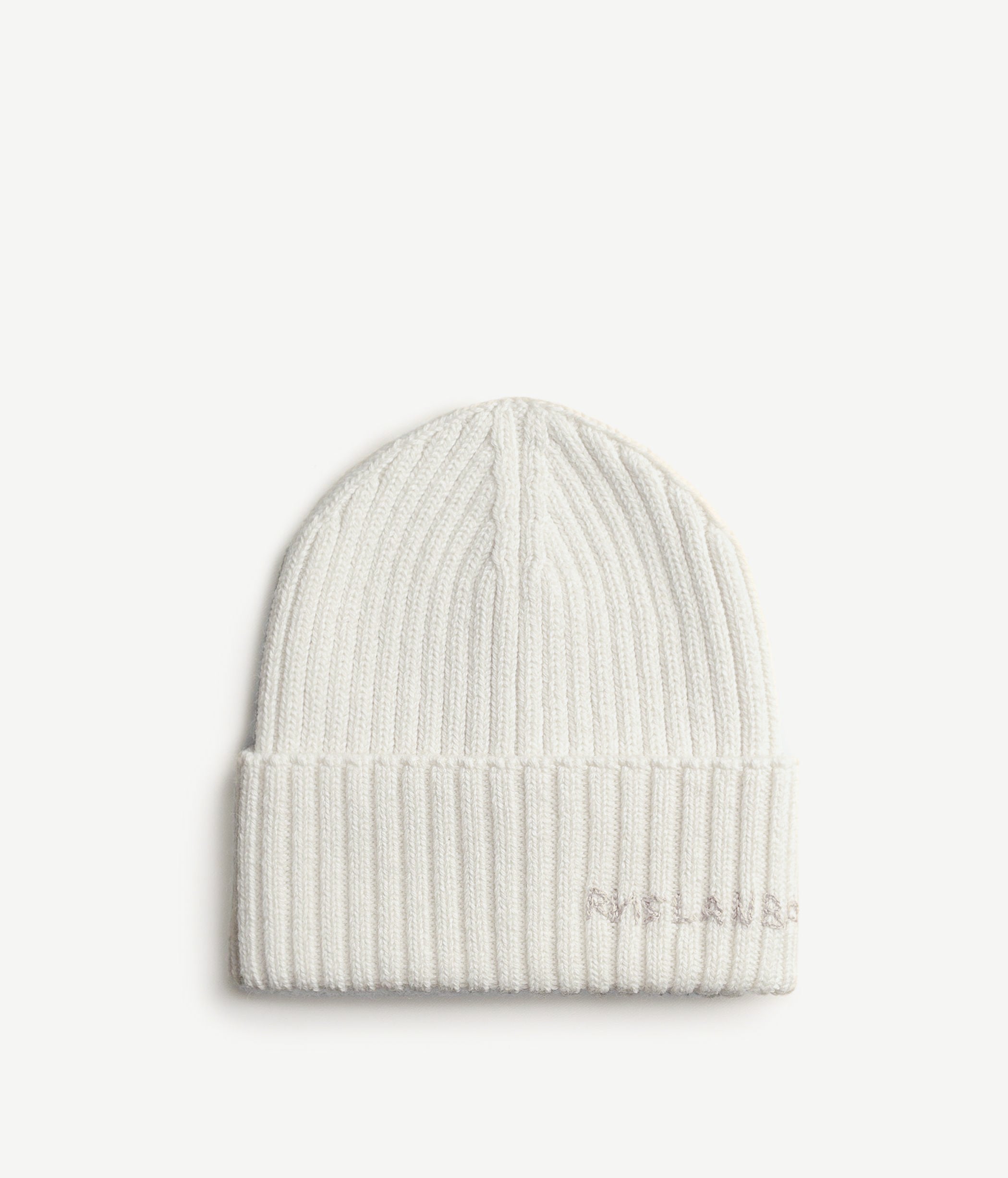 All Knits, Ruslan Baginskiy light beanie hat is a tool to start the new season with a clean slate. It’s believed that a white t-shirt is the best option to refresh an outfit but an off-white headpiece can do the same. Moreover, it can keep you warm during the colder times of the year. When the days get complicated, we always reach for something clean and simple, and it never fails. The ribbed texture of a time-tested piece is embellished with a hand-embroidered logo. There is a saying that goes like “all cry no wool”, but a single beanie transforms it into “all wool, no cold”.