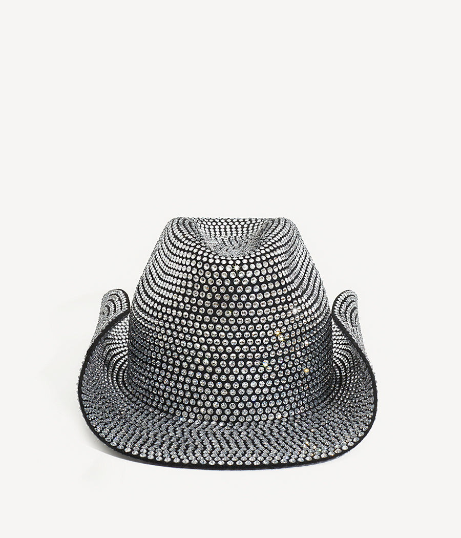 ALLwithoudDIS, Ruslan Baginskiy presents probably the shiniest cowboy hat that ever existed. A cowboy hat style was popularized through Hollywood Western movies, but we decided to completely reimagine its purpose. Obviously, this is not a kind of hat for taking a horse to the old town road, unless it brings you to the party.Traditionally, this style features a pinched crown and a low rodeo brim. This time they are fully covered in crystals, forming a limited edition cowboy hat. Being shamelessly sparkling per se, this hat will create a hypnotizing combination with a sparkle in your eyes.