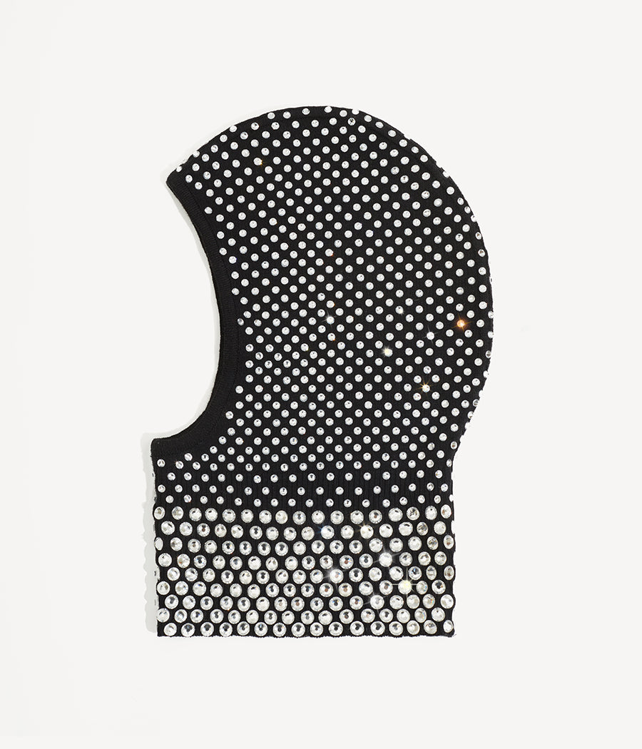 All Knits, Ruslan Baginskiy Чорна Балаклава з КристаламиВиготовлена з м'якої, ніжної вовни чорного кольору, оздоблена сяючими кристалами. Кожен кристал викладений та закріплений вручну, що забезпечує довговічність декору.Створено в Україні.